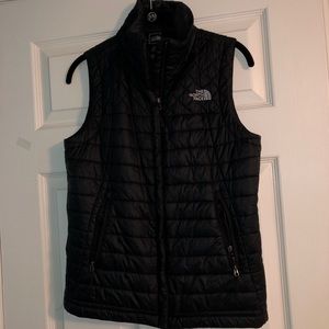 Woman’s black North Face vest